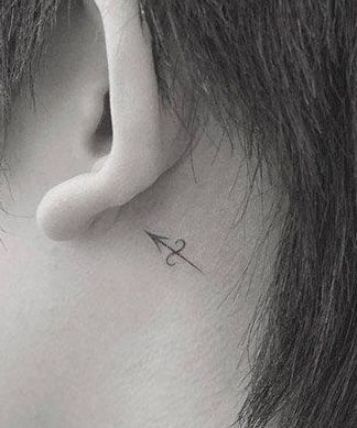 Minimalist arrow with Sagittarius symbol tattoo design for women behind the ear tattoo ideas