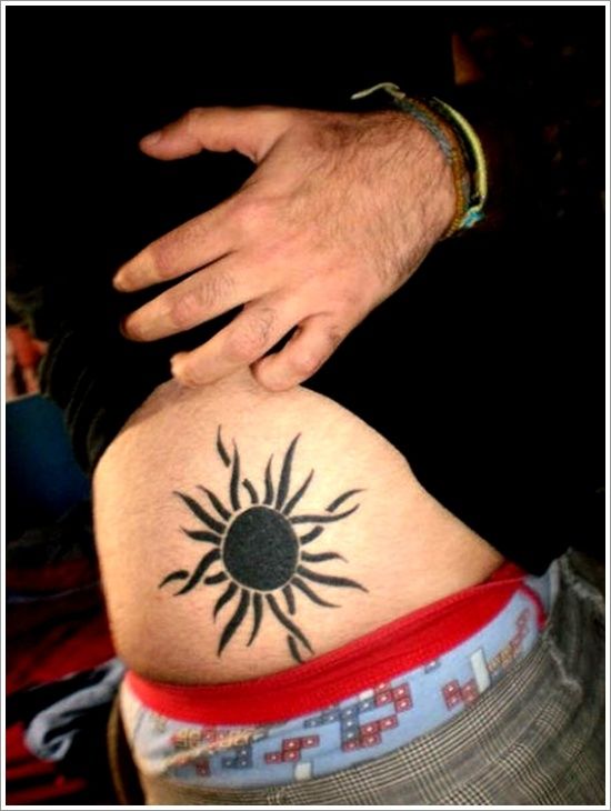 Tribal sun tattoo design for men on hip tattoo ideas