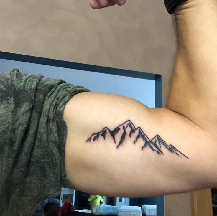Linework mountain tattoo design for men on bicep tattoo ideas