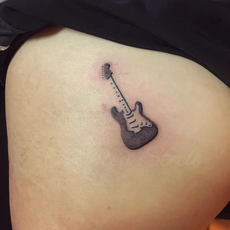 Blackwork guitar tattoo design for women on hip tattoo ideas
