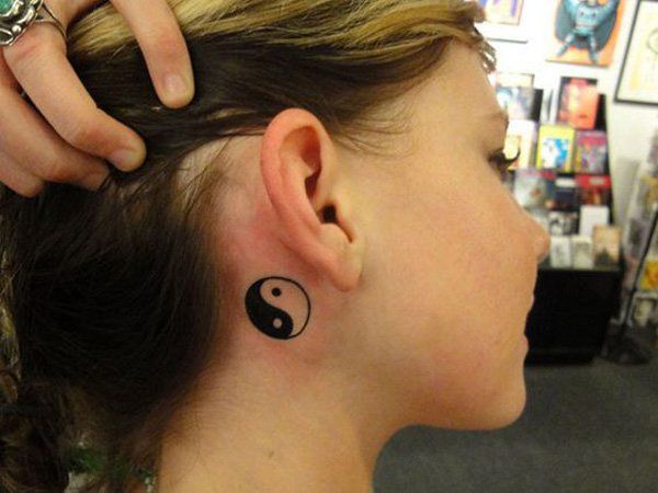 Yin Yang tattoo design for women behind the ear tattoo ideas