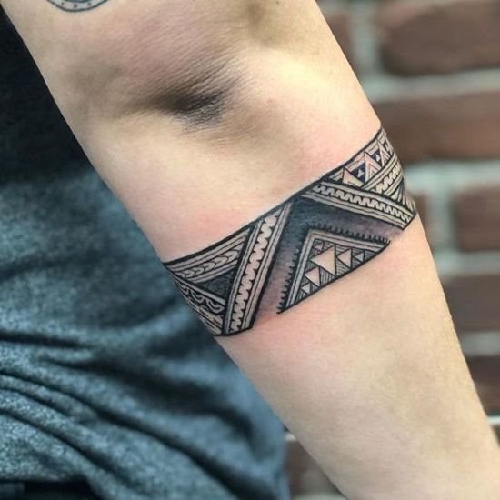 Tribal arm band tattoo design for men and women with geometric patterns tattoo ideas