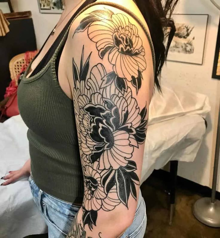 Traditional floral tattoo design for women on arm, half sleeve tattoo ideas