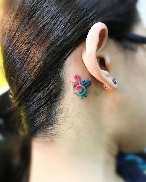 Watercolor Taurus tattoo design for women behind the ear tattoo ideas