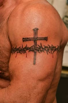 Blackwork cross and crown band tattoo design for men on arm tattoo ideas