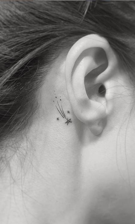 Minimalist star and space tattoo design for women behind the ear tattoo ideas