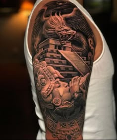 Realism dragon and Aztec warrior tattoo design for men on bicep tattoo ideas