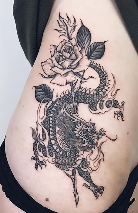 Black and grey dragon and rose tattoo design for women on hip tattoo ideas