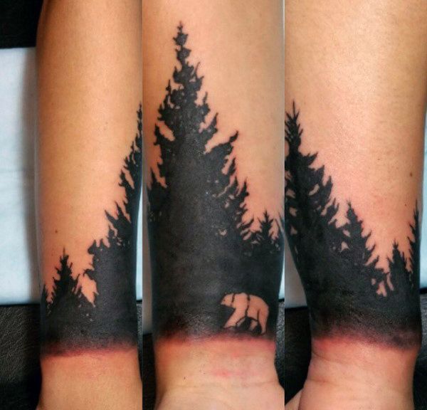 Blackwork forest silhouette with bear tattoo design for men and women tattoo ideas