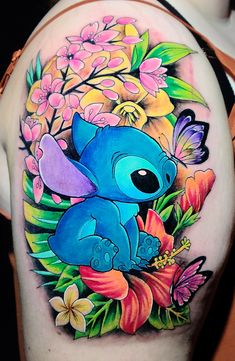 Anime Stitch and floral tattoo design for women on shoulder tattoo ideas