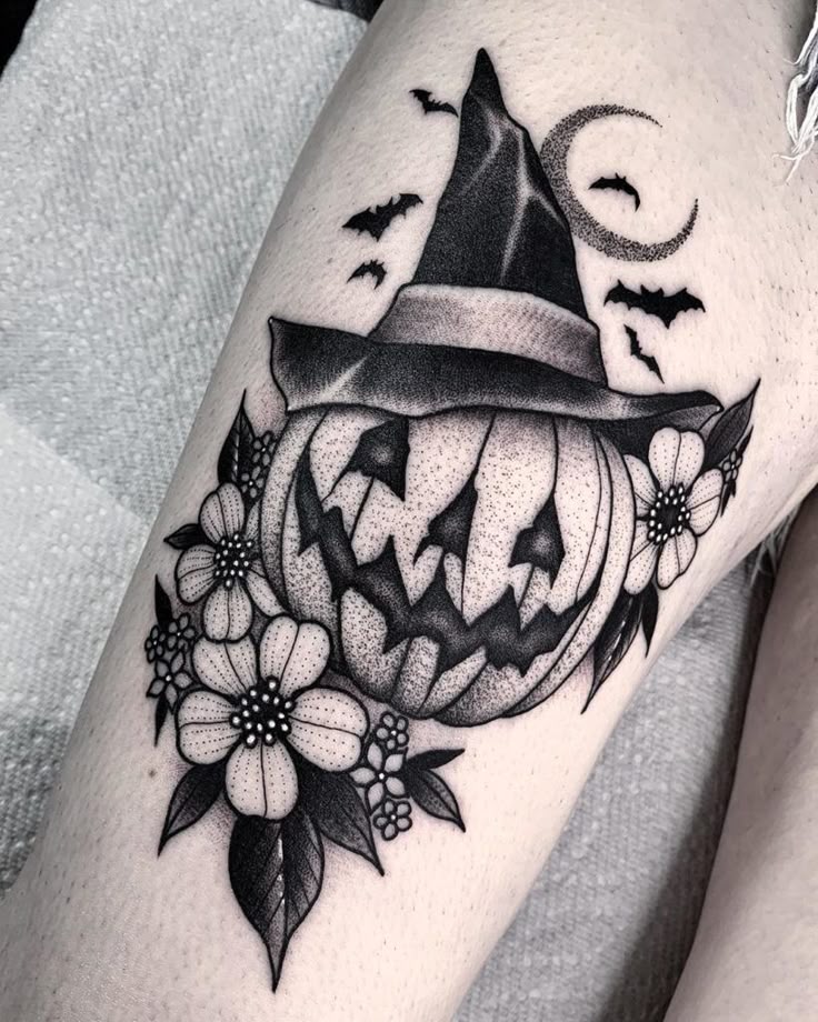 Dotwork flower, moon, bats and witch hat pumpkin tattoo design for women on thigh tattoo ideas