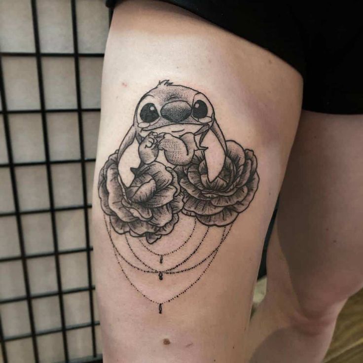 Black and Grey Stitch and floral tattoo design for women on thigh tattoo ideas