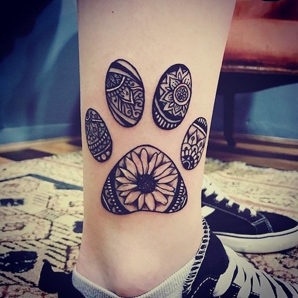 Dotwork paw print with mandala and flower tattoo design for women on ankle tattoo ideas