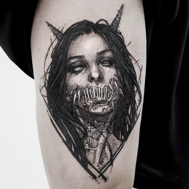 Blackwork demon face tattoo design for women on thigh tattoo ideas