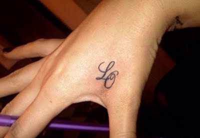 Fine line initial tattoo design for women on hand tattoo ideas