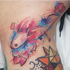 Watercolor axolotl and flower tattoo design for women on rib tattoo ideas