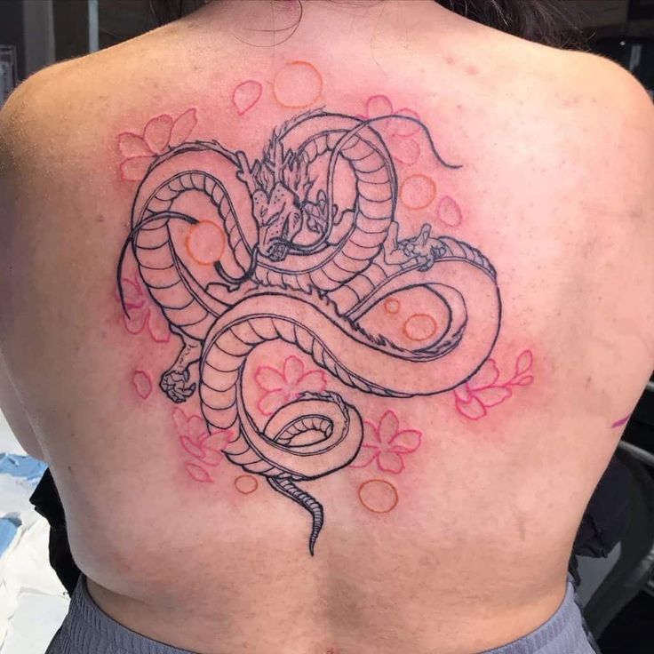 Black and grey dragon and flower tattoo design for women on back tattoo ideas