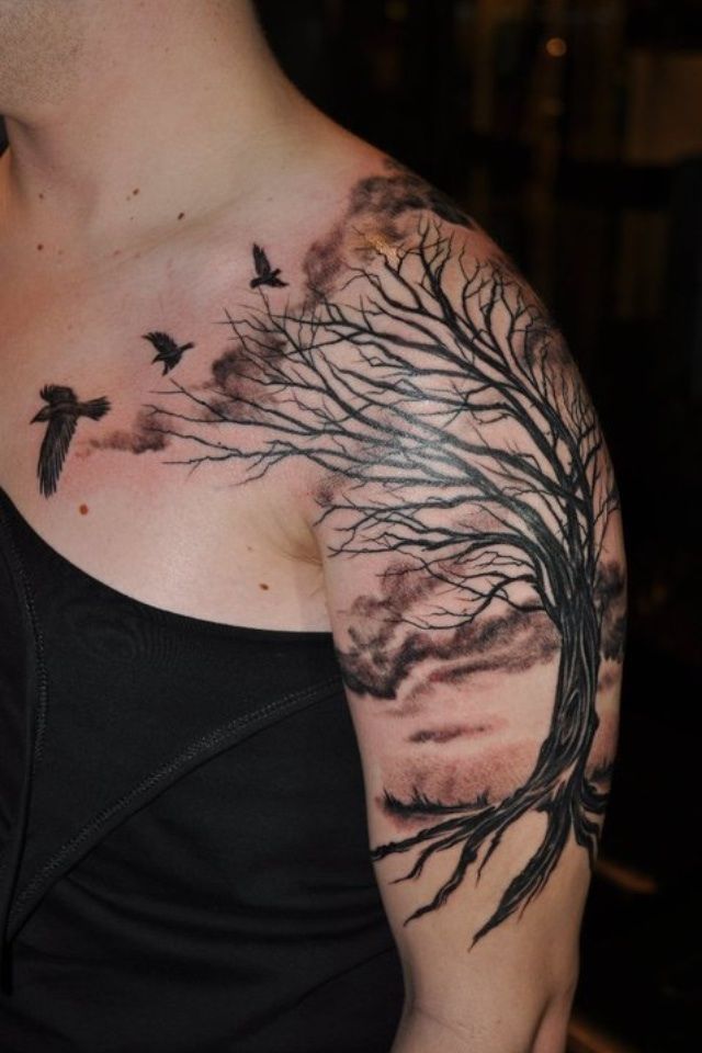 Black and grey tree and bird tattoo design for men on arm and shoulder tattoo ideas