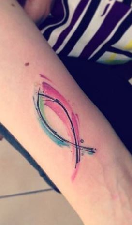 Watercolor fish Christian religious tattoo design for women on forearm tattoo ideas