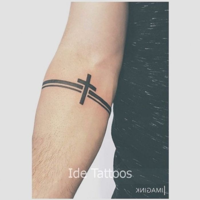 Blackwork cross tattoo design on arm for men tattoo ideas