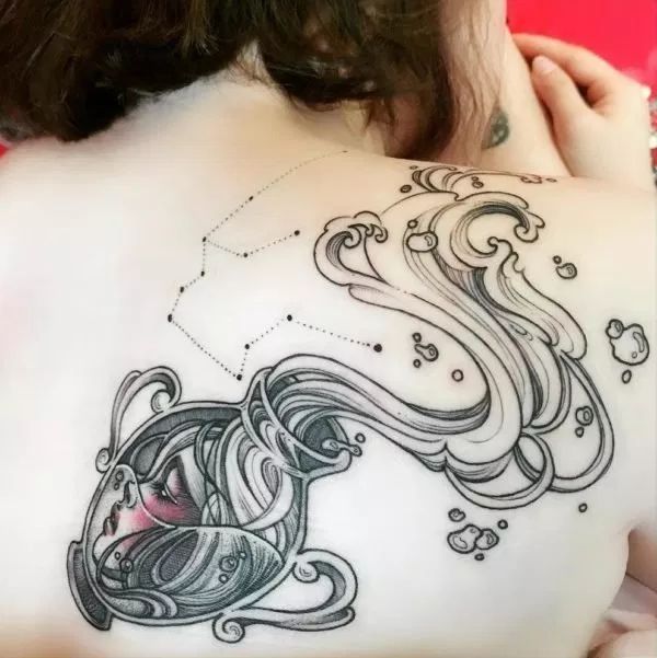 Black and grey Aquarius water and star tattoo design for women on back tattoo ideas