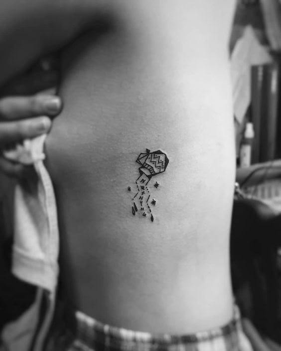 Geometric Aquarius tattoo design for women on rib tattoo ideas