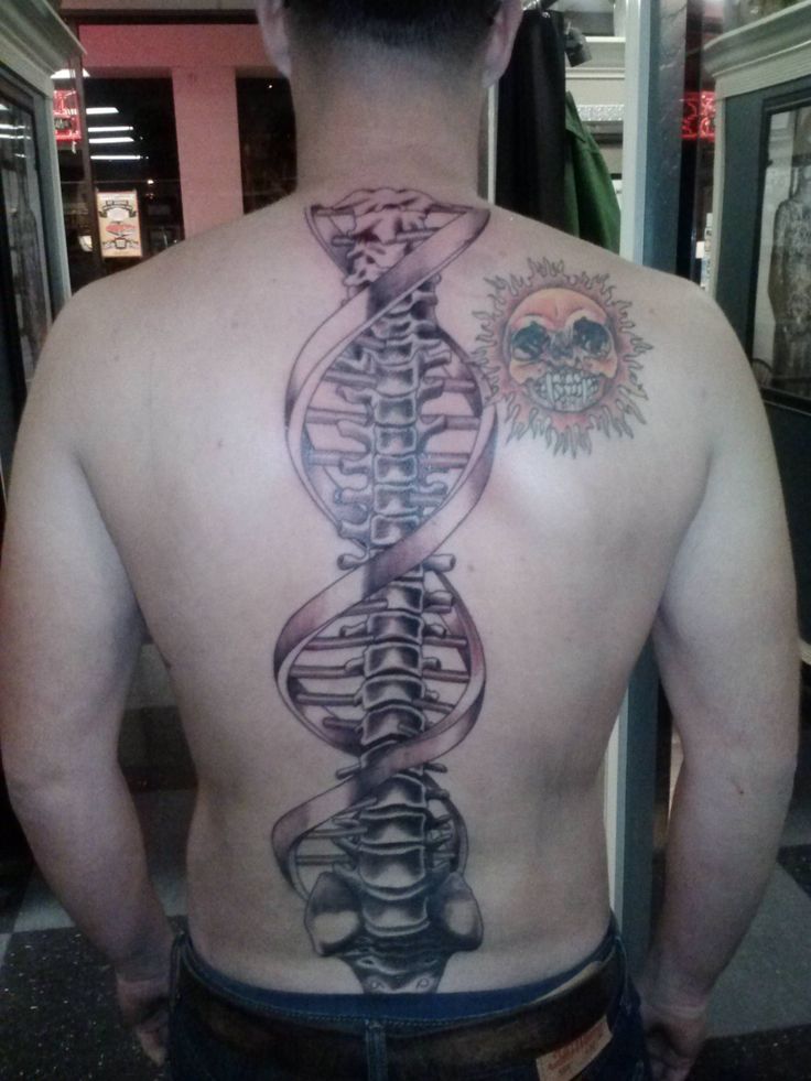 Realistic skull and sun tattoo design for men on back tattoo ideas