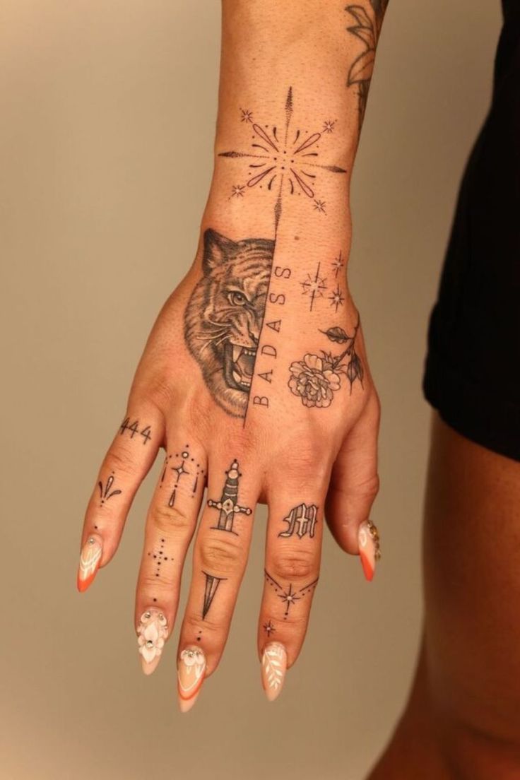 Fine line tiger, rose, and floral tattoo design for women on hand and wrist tattoo ideas