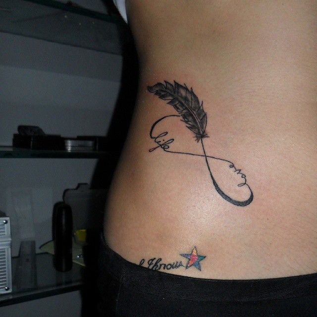 Fine line feather infinity with quotes tattoo design for women on rib tattoo ideas