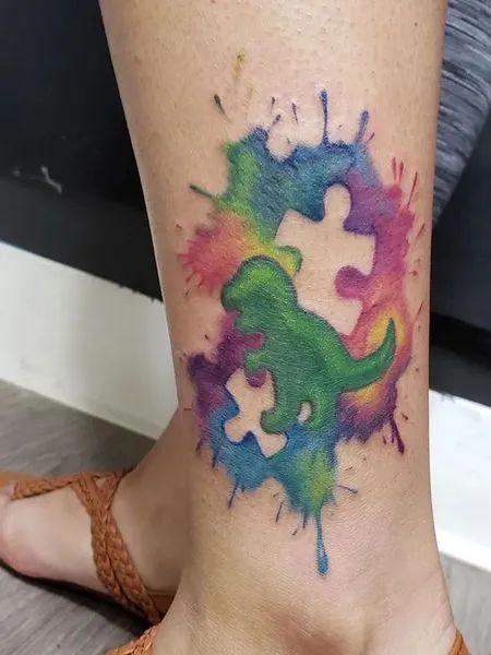Watercolor autism and dinosaur tattoo design for women on leg tattoo ideas