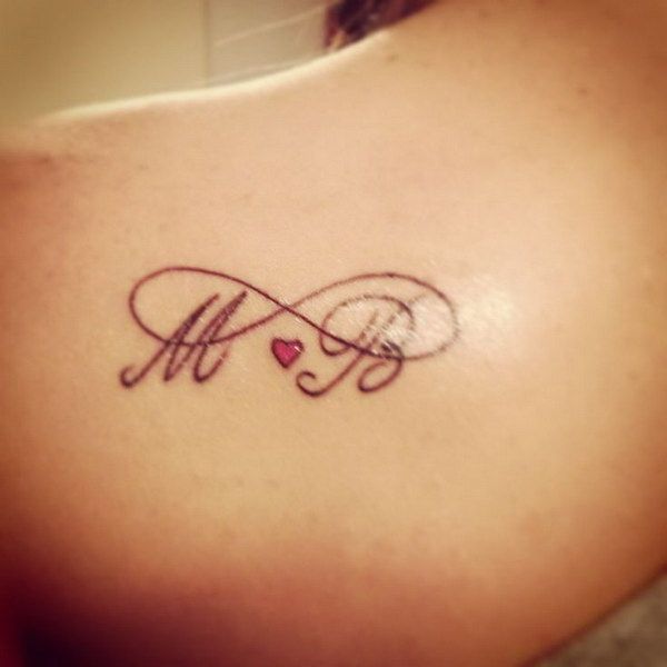 Fine line infinity symbol with initials and heart tattoo design for women on shoulder tattoo ideas