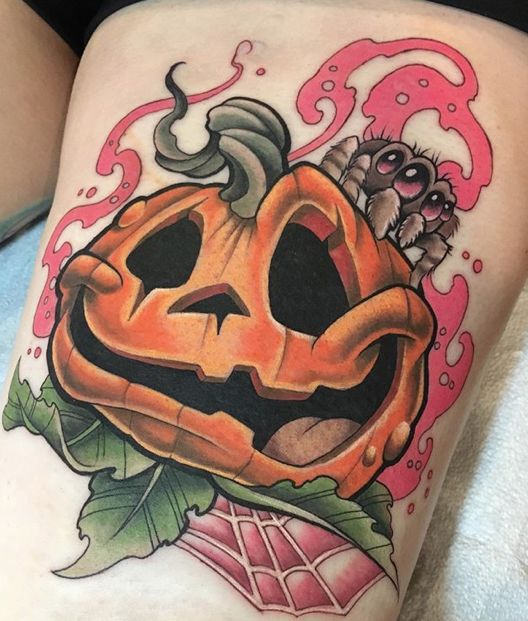 Neo-traditional spider and pumpkin tattoo design for women on thigh tattoo ideas