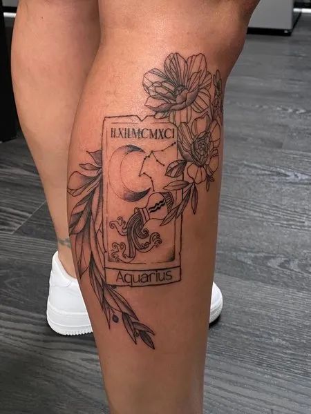 Fine line Aquarius moon and flower tattoo design for women on leg tattoo ideas