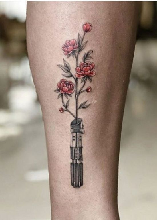 Realistic flower and star wars lightsaber tattoo design for women on leg tattoo ideas