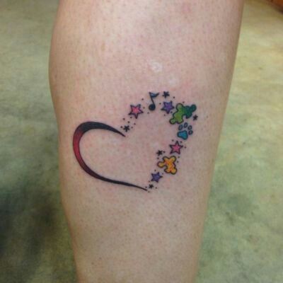 Minimalist heart with autism awareness and music note tattoo design for women on leg tattoo ideas