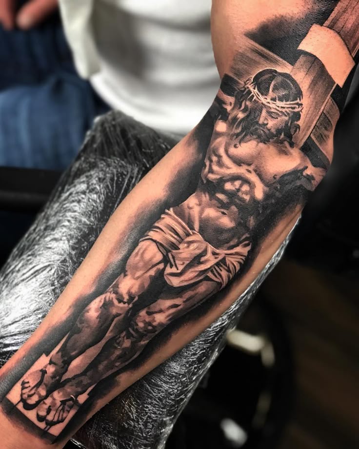 Realistic Jesus tattoo design for men on arm tattoo ideas
