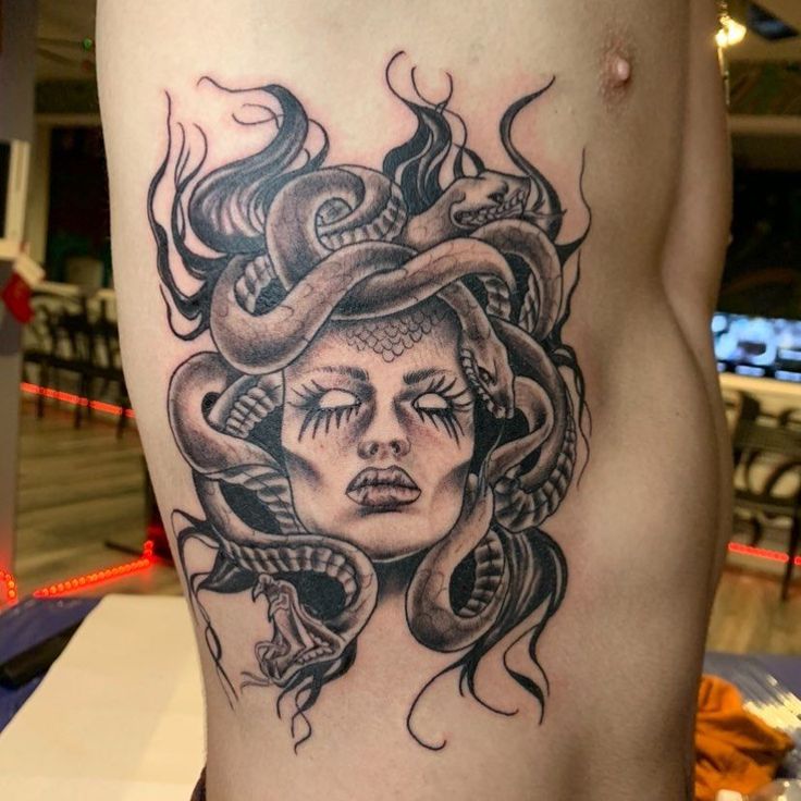 Realistic Medusa snake tattoo design
 for women on rib tattoo ideas