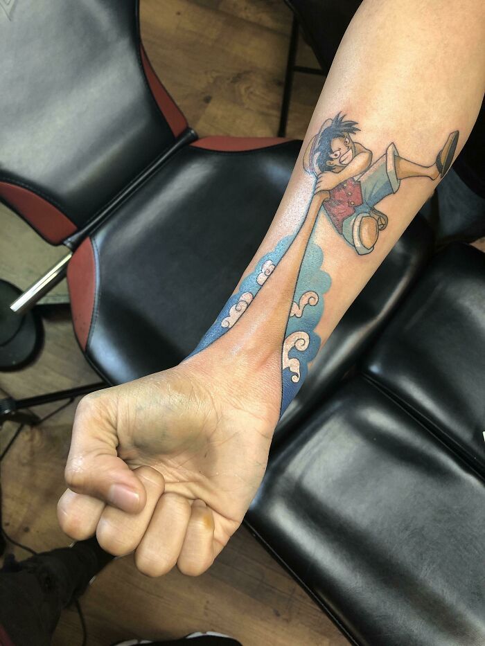Anime one piece tattoo design for men on forearm and wrist tattoo ideas