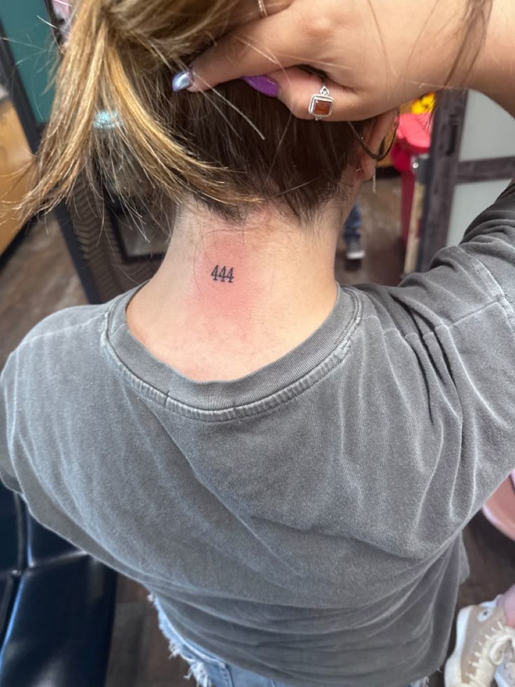 Minimalist 444 angel number tattoo design for women on neck tattoo ideas