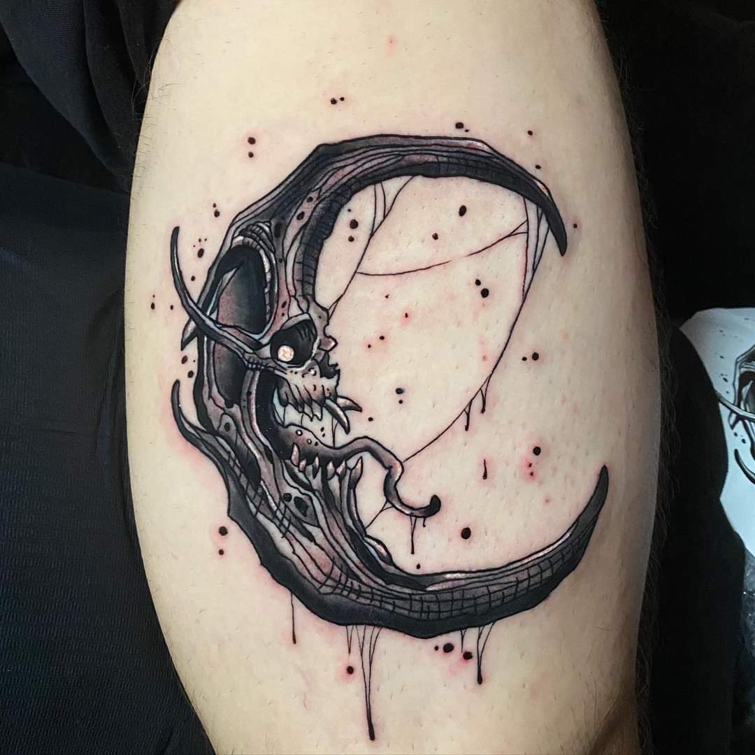 Blackwork moon and skull tattoo design for men and women on leg tattoo ideas