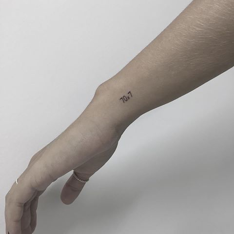 Fine line Roman numeral tattoo design for women on wrist tattoo ideas