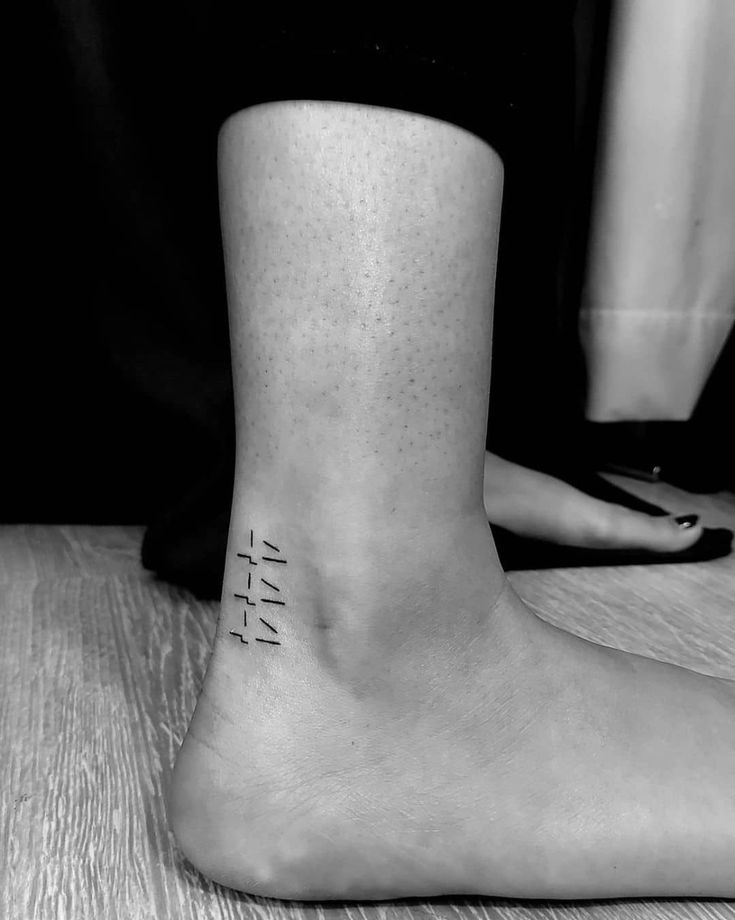 Minimalist numeric code tattoo design for women on ankle tattoo ideas
