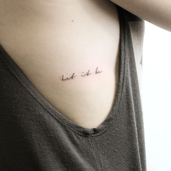 Minimal script tattoo for women on rib tattoo ideas