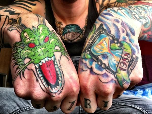 New School dragon and clock tattoo design for men on hand tattoo ideas