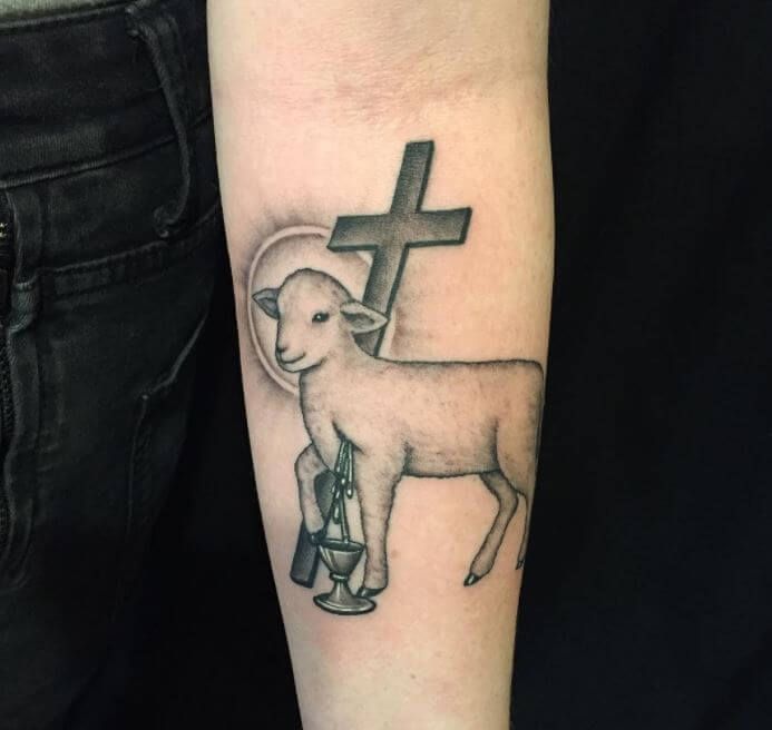 Realistic lamb and cross religious tattoo design for men and women on forearm tattoo ideas