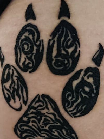 Tribal paw print tattoo design for men and women on leg tattoo ideas