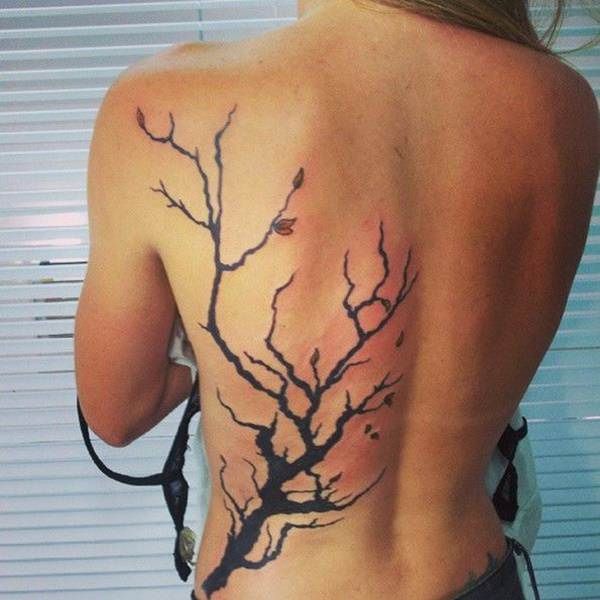 Blackwork tree and floral tattoo design for women on back tattoo ideas