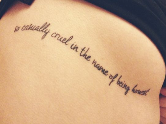 Script word tattoo design for women on rib tattoo ideas
