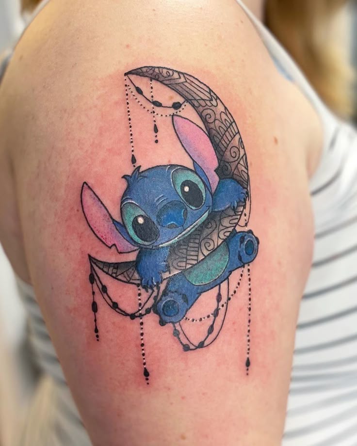 Anime Stitch and moon tattoo design for women on shoulder tattoo ideas