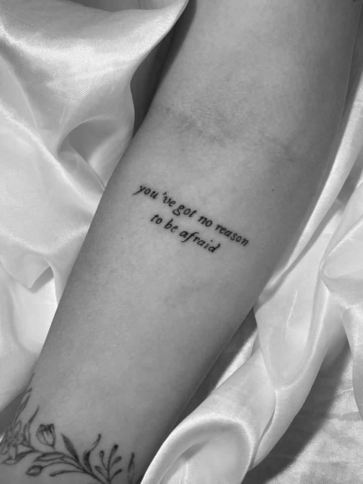 Fine line quote with floral tattoo design for women on forearm tattoo ideas